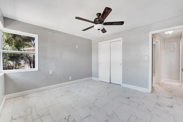 unfurnished bedroom with a closet and ceiling fan