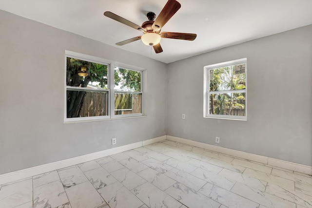 spare room with ceiling fan