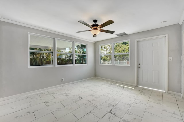 spare room with ceiling fan