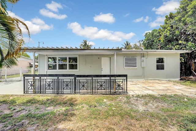 rear view of house with a patio area