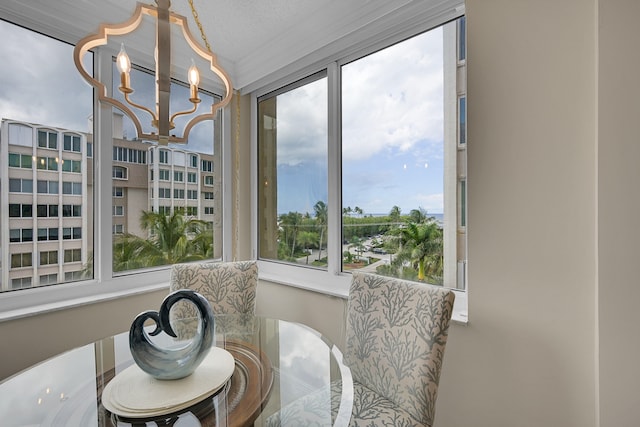 sunroom with an inviting chandelier and a healthy amount of sunlight