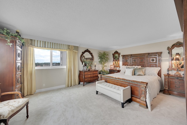 bedroom with light colored carpet, a textured ceiling, and ornamental molding