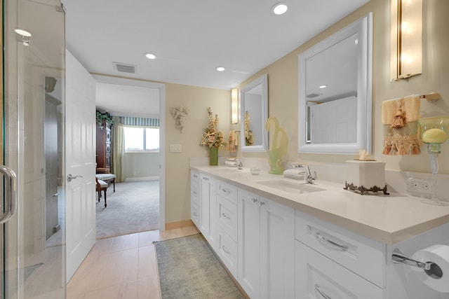 bathroom with tile patterned floors and vanity