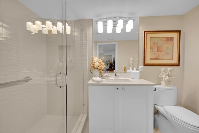 bathroom with vanity, toilet, and walk in shower