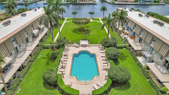 birds eye view of property with a water view