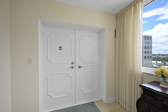 entrance foyer featuring light tile patterned floors