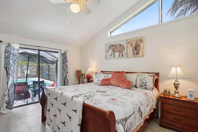 bedroom featuring a textured ceiling, access to outside, ceiling fan, and lofted ceiling