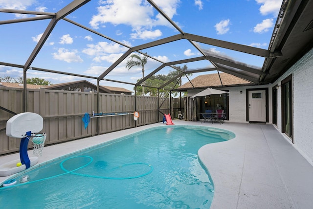 view of pool featuring a lanai and a patio