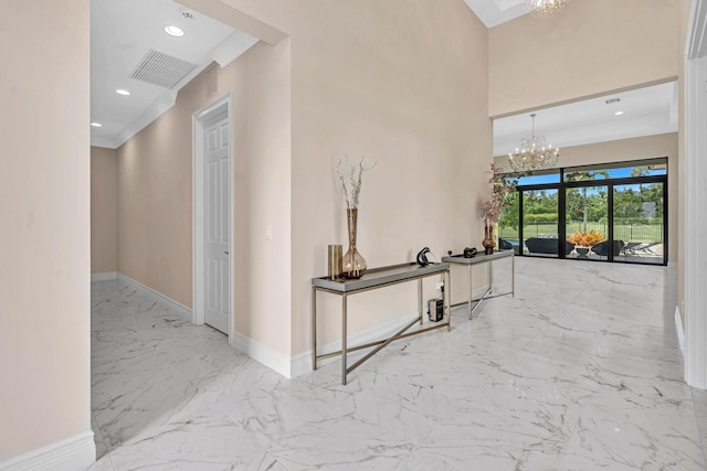 hallway featuring recessed lighting, visible vents, baseboards, marble finish floor, and an inviting chandelier