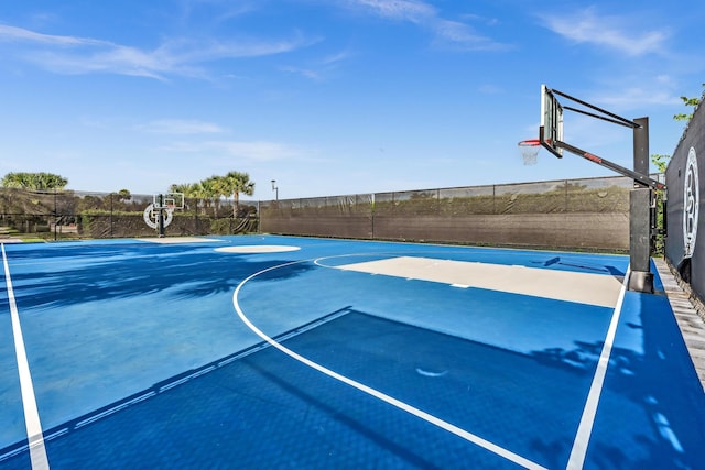 view of sport court featuring community basketball court and fence