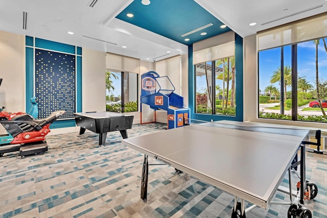 recreation room with carpet floors, a wealth of natural light, and recessed lighting