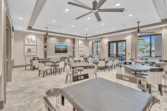 dining space with a tray ceiling, carpet flooring, a ceiling fan, and recessed lighting