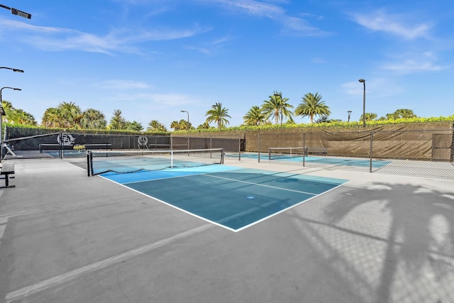 view of sport court with fence