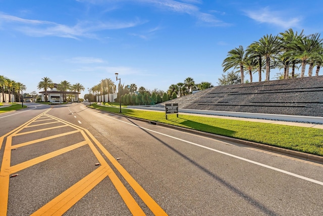 view of street featuring curbs and street lights