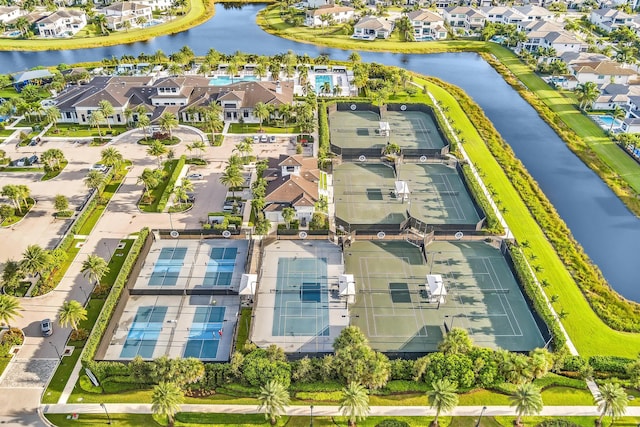 birds eye view of property with a water view and a residential view