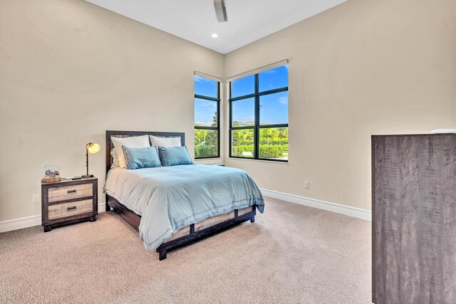 bedroom featuring ceiling fan and carpet