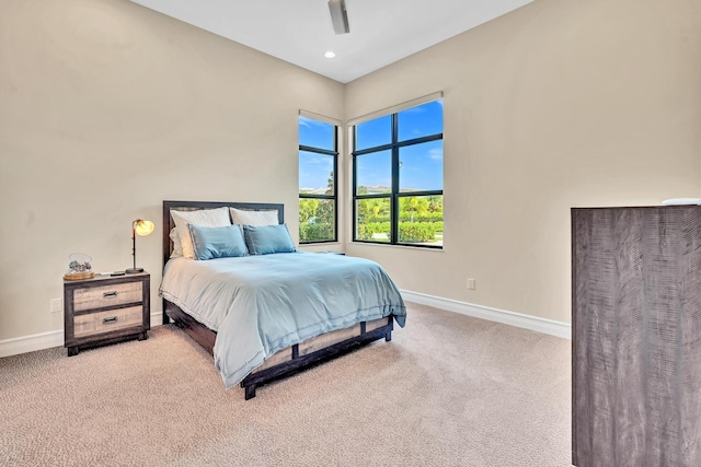 carpeted bedroom with a ceiling fan, recessed lighting, and baseboards