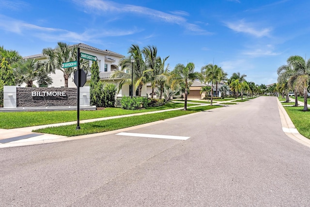 view of road with sidewalks and curbs