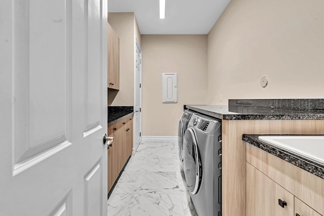 clothes washing area with cabinets, light tile patterned floors, and independent washer and dryer