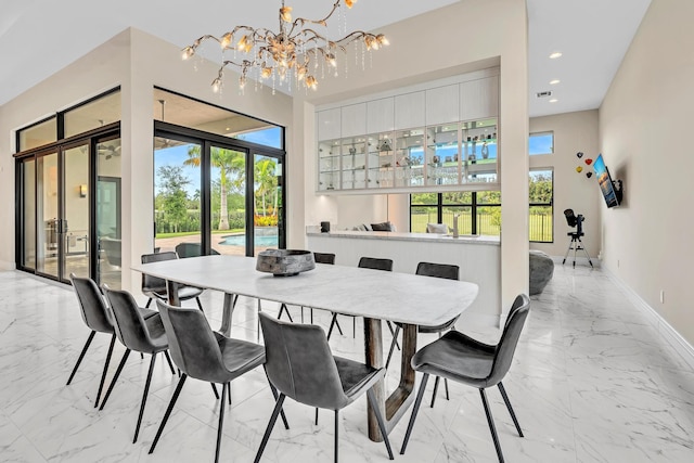 dining room with a wealth of natural light and marble finish floor