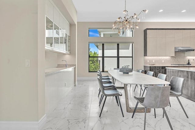 tiled dining area featuring a notable chandelier