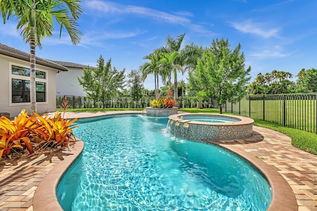 view of pool featuring fence, a fenced in pool, and an in ground hot tub