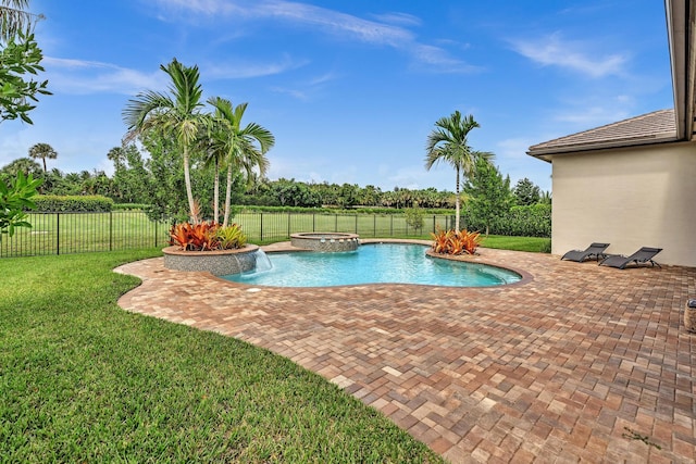 view of swimming pool with a yard, a patio, a fenced backyard, and a pool with connected hot tub