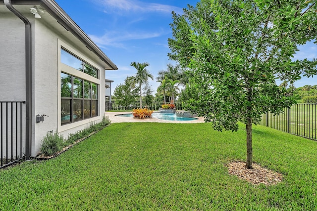 view of yard featuring fence and a fenced in pool