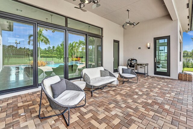 view of patio / terrace featuring ceiling fan