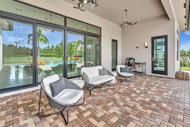 view of patio featuring ceiling fan