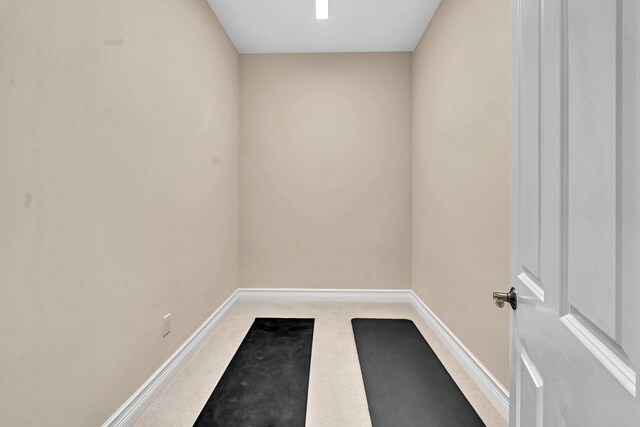 empty room with light colored carpet