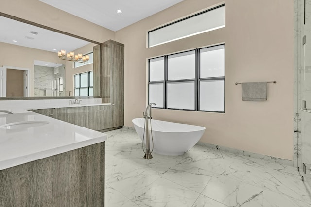 full bathroom with double vanity, a marble finish shower, a soaking tub, marble finish floor, and a sink