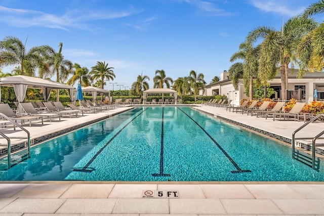 pool featuring a patio and a gazebo