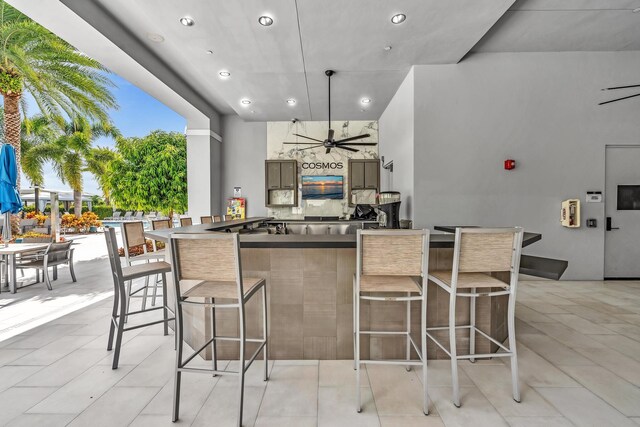 view of patio / terrace featuring an outdoor bar