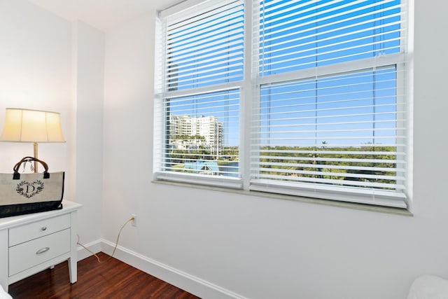 unfurnished bedroom with dark hardwood / wood-style floors