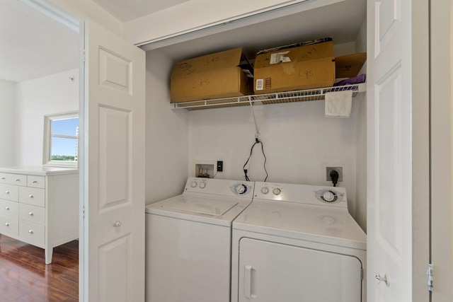 laundry area with washer and clothes dryer and hardwood / wood-style flooring