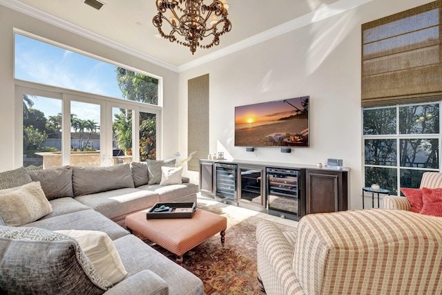 living room featuring ornamental molding and sink