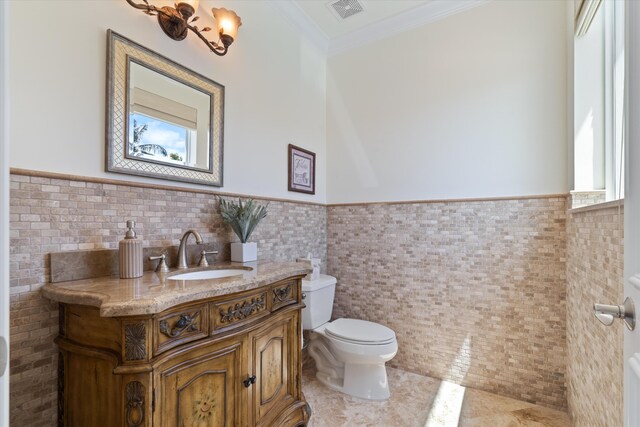 kitchen with light stone countertops, sink, built in appliances, decorative backsplash, and custom range hood