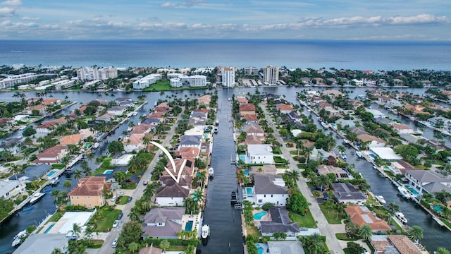 bird's eye view featuring a water view and a residential view