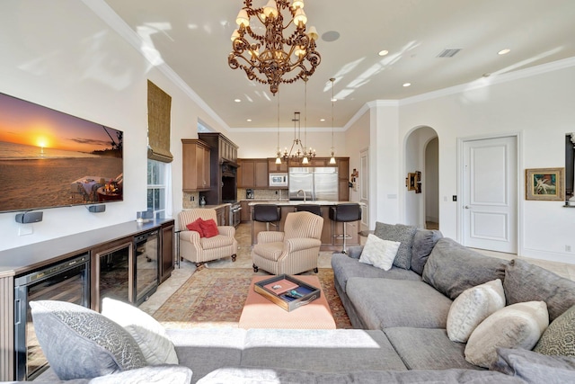 office area with plenty of natural light, ornamental molding, a high ceiling, and a tray ceiling