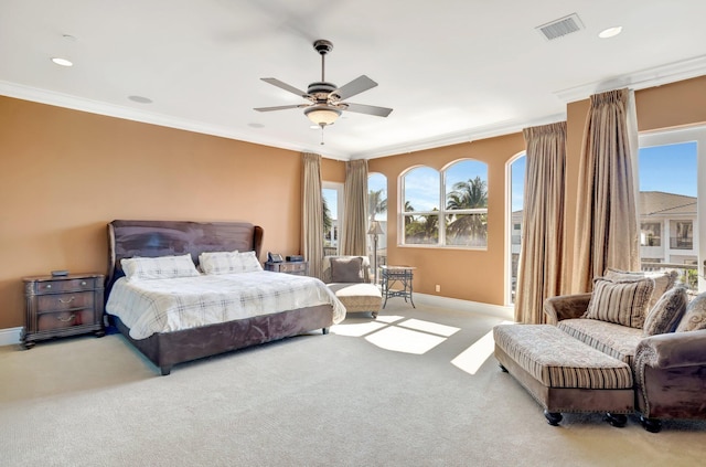 bedroom featuring ceiling fan, carpet floors, and crown molding