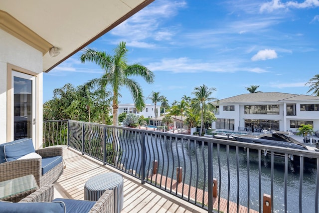 view of pool with a patio area, a dock, and a water view