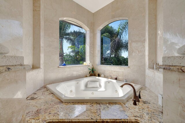 bathroom featuring ornate columns and walk in shower