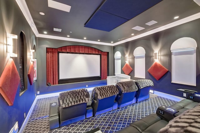 home theater with carpet floors and crown molding