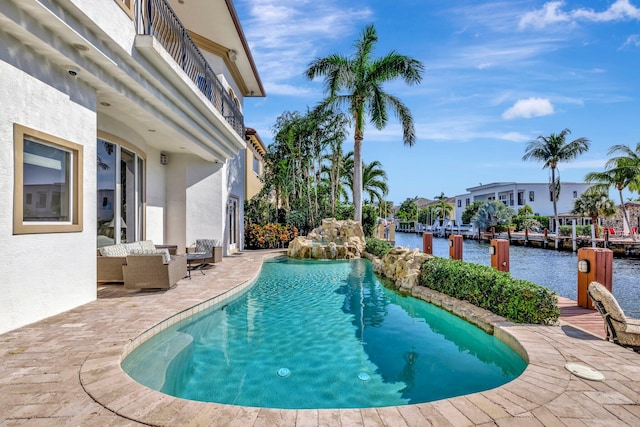 view of swimming pool with a patio area