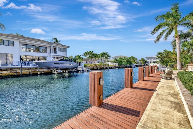 view of patio / terrace with a water view and a grill