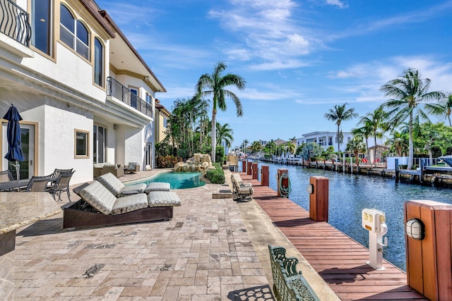 view of pool featuring outdoor lounge area and a patio