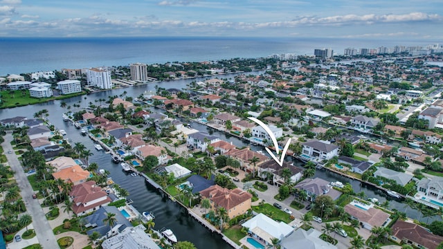 birds eye view of property featuring a water view