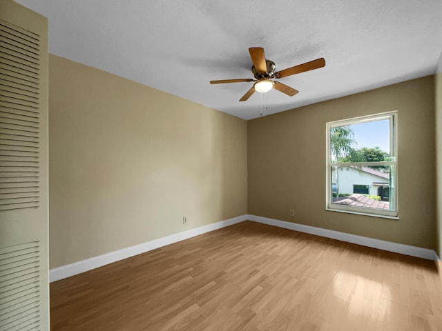 unfurnished room featuring ceiling fan and light hardwood / wood-style floors