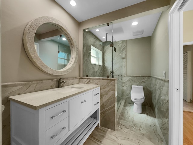 bathroom featuring toilet, vanity, and walk in shower